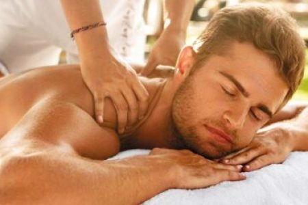 Handsome man getting swedish massage